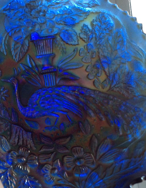 blue Carnival glass bowl in the Peacock and Urn pattern with Bearded Berry Fenton